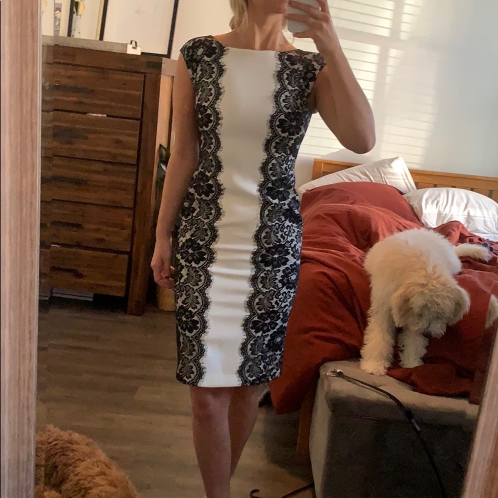 White dress with black lace and and accent belt